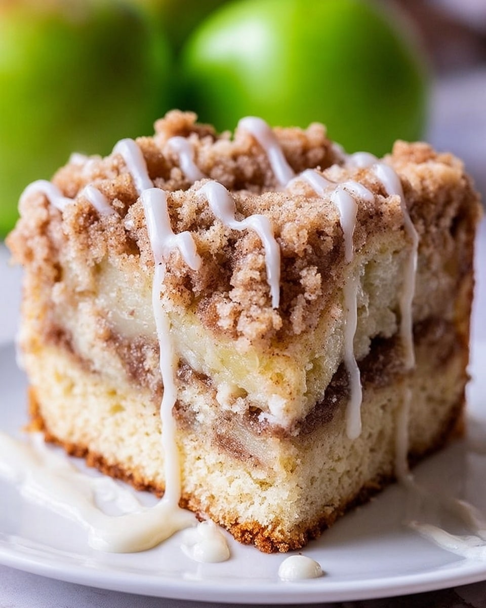 The image shows several slices of a loaf with four distinct layers. The bottom layer is a light golden cake base with a firm texture. The second layer consists of soft, brownish cooked apple pieces sliced unevenly. The third layer is a thick, creamy yellow custard-like filling that looks smooth and rich. The top layer is a crumbly streusel with a mix of light brown and oat-colored crumbs, sprinkled with small white icing drizzles in thin lines. The background surface is white marbled texture with green apples and cinnamon sticks placed as decoration. Photo taken with an iphone --ar 4:5 --v 7