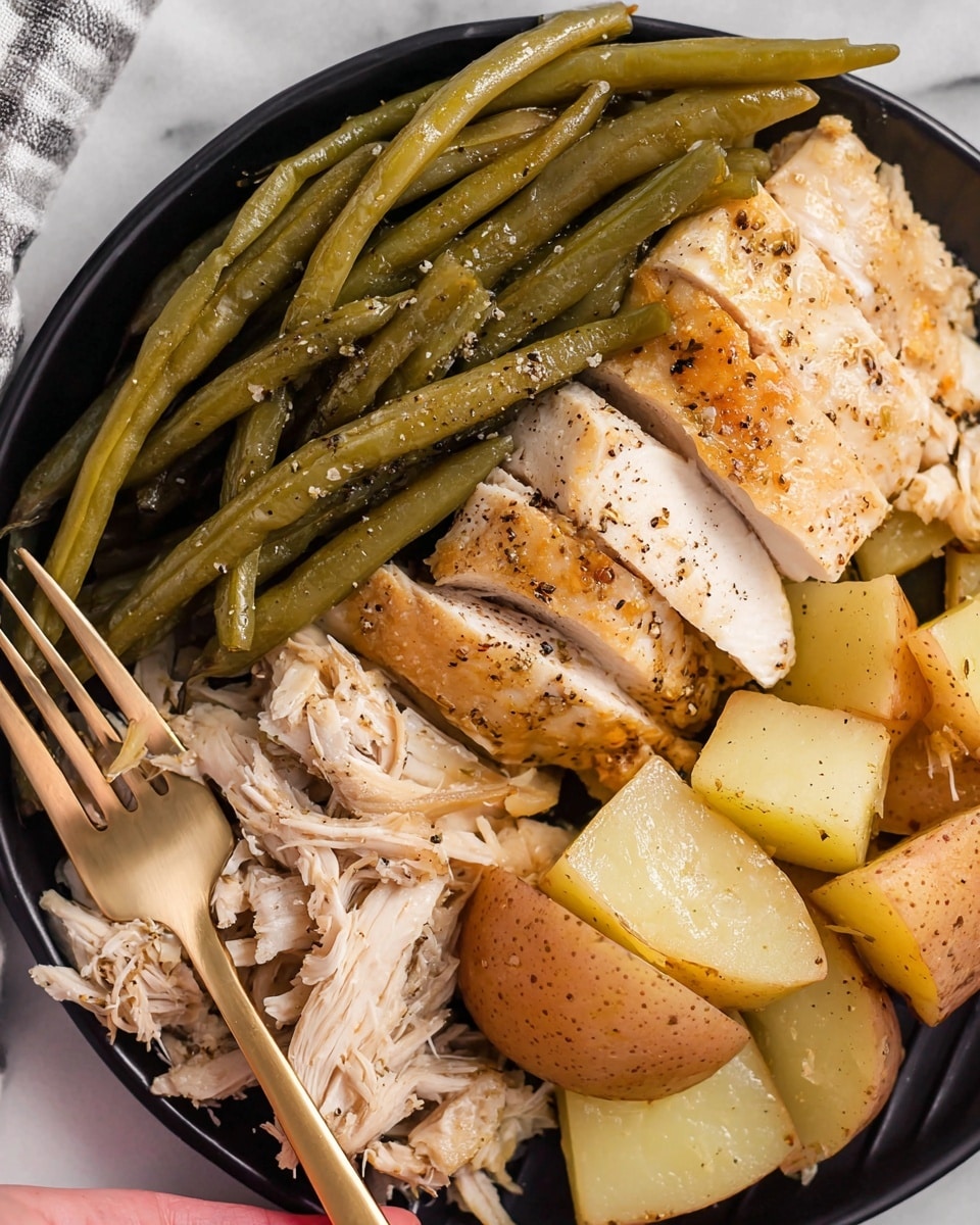The image shows a close-up of a white plate with cooked food arranged in layers. At the top, there are several long green beans with a shiny, lightly seasoned surface. Below the green beans is a golden-brown roasted chicken breast, cut into thick slices revealing tender, white meat inside, sprinkled with black pepper and garlic bits. To the right of the chicken, there are chunky potato pieces with a light golden color and some black pepper seasoning. The texture of the chicken is slightly moist and flaky, and the potatoes have a smooth cooked surface. The plate sits on a white marbled surface with a glimpse of a textured cloth napkin in the corner. Photo taken with an iphone --ar 4:5 --v 7